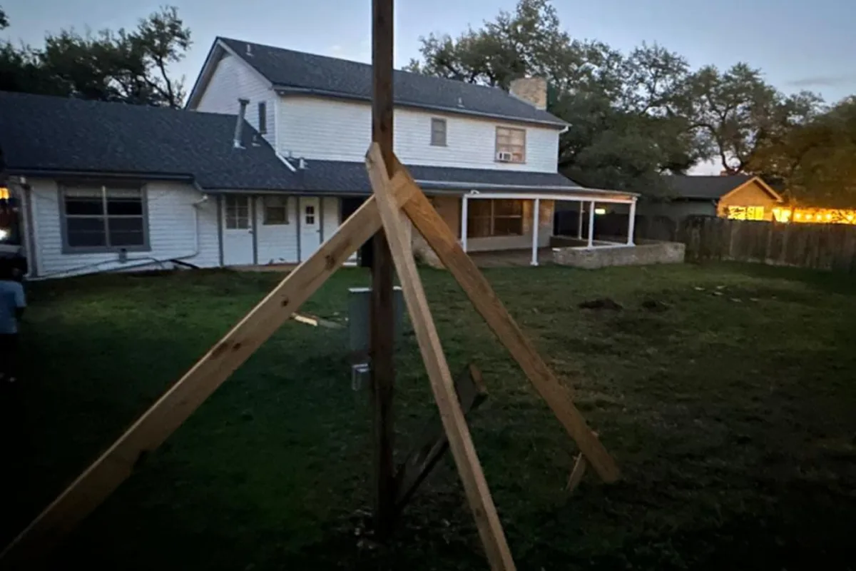 Braced patio cover posts prepared for concrete footings in Central Texas